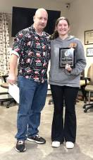 Board member Kevin Palacino and Kaitlyn Kahrmann with her Youth Sportsman of the Year award.