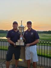 Port Authority Police Officers Joe Della Serra and Geoff Jeppson hold the championship trophy.