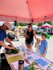 A typical day at the farmers market this year.