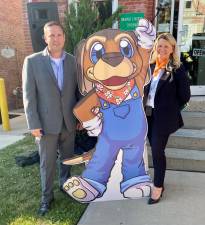 Orange County Executive Steven Neuhaus and Director of Orange County Tourism &amp; Film Director Amanda Dean pose with Hudson, the new Orange County tourism mascot.