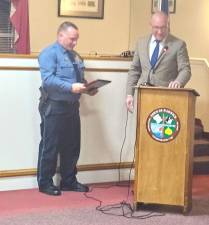 Warwick Supervisor Jesse Dwyer honors Warwick Town Police Chief John Rader.