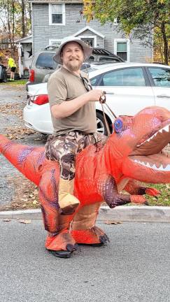 A dino-clad parade-goer.