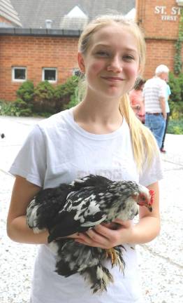 Photos by Roger Gavan Grace Morgiewiz, 12, brought her pet chicken, &quot;Salt.&quot;