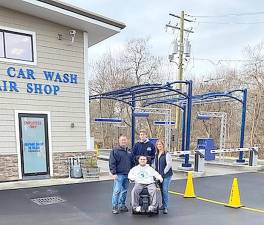 Warwick Car Wash owner Paul LeDuc with his family. From left, Paul LeDuc, his sons Andrew and Kyle (seated) and wife Tara. Provided photo.