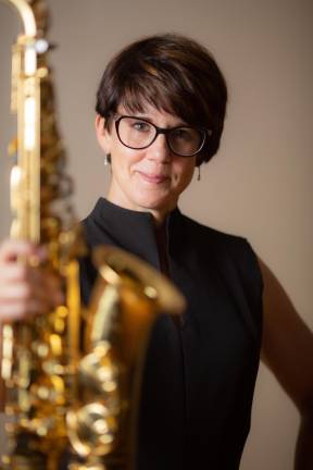 Lois Hicks-Wozniak on the sax and flute.