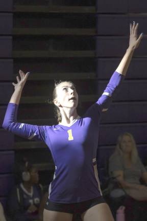 A Wildcat readies her shot during the eight-team volleyball invitational tournament.