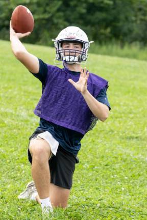 Players run through drills on the first day of football practice on Aug. 19, 2024.