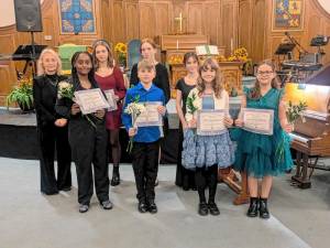 L-R Front: Abigiya Bekele-Arcuri, Wesley Lewkiewicz, June Wetherell-Toro, and Aviana Roycroft. L-R Back: Ann Lewkiewicz, Gwen Lewkiewicz Redman, Grace Stough, and Sophia Amato.