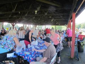 Seniors enjoy the bountiful food at the annual barbecue.