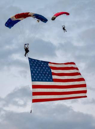 Skydivers deliver the American flag at the beginning of the air show. (Photo courtesy of the Greenwood Lake Air Show)