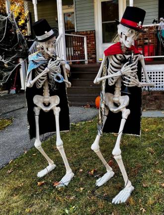 <b>Musical skeletons are on display playing instruments in front of a house on Grand Street in Goshen, NY. (Photo by Beth Quinn)</b>