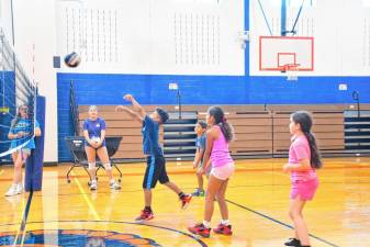 The clinic taught kids how to play volleyball.