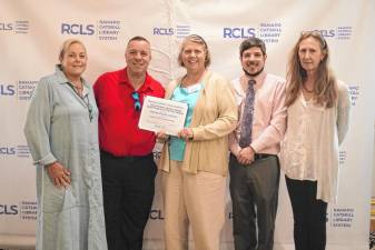 Assemblyman Karl Brabenec congratulates the staff of the Florida Public Library on their recent “Program of the Year” award.