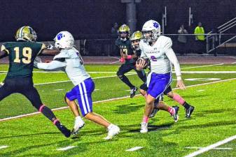 Warwick QB Brody Frederick, #2, threw three touchdown passes and rushed for 66 yards in the 35-14 win over the Presidents.