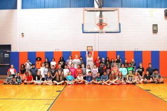 Golden Hill’s fifth grade chorus celebrates their gold recognition.