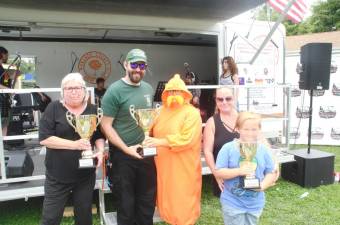 The winners of the parade float contest: representatives from the Greenwood Lake school district, Warwick EMS, and Cub Scout Pack 121.