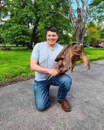 Florida Mayor Daniel Harter Jr. with the snapping turtle.