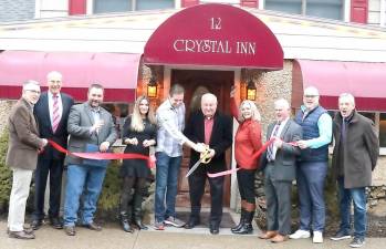 On Tuesday, Feb. 18, (from left) Town of Warwick Supervisor Michael Sweeton, Justice Peter Barlet, Orange County Legislator Paul Ruszkiewicz and members of the Warwick Valley Chamber of Commerce (on right) joined second-generation owner Gus Zygmunt, his son Ryan and his fiancée Lauren Conte (center) to formally celebrate the historic restaurant’s 55th anniversary.