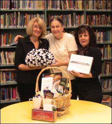 Library volunteers preparing for holiday raffle and sale
