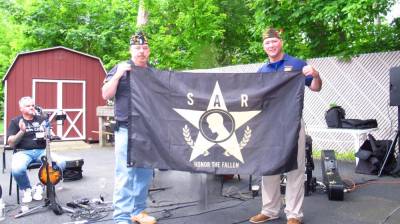 GWL American Legion CDR Walter Kittle, left, and Joe Braskey, VSO Liason to SAR, hold the SAR flag after Braskey presented the flag to Kittle.