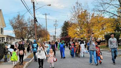 Spooky, silly, and heroic characters crowded Warwick streets on Halloween as part of the annual parade.