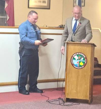 Warwick Supervisor Jesse Dwyer honors Warwick Town Police Chief John Rader.