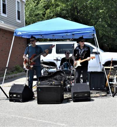 Blueschamber plays classic 1960s songs as well as current rock and blues numbers during the street festival. From left are Eric Delisi on bass, Bob Shupp on drums and Rick Dittamo on guitar and vocals.