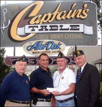 Captain's Table in Monroe raises $1,000 for Wounded Warriors