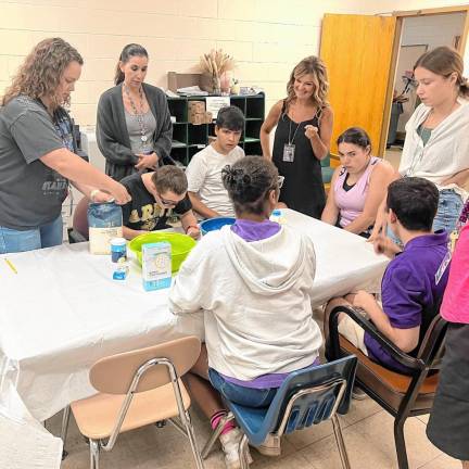 Students learn how to mix and create their own pancakes.