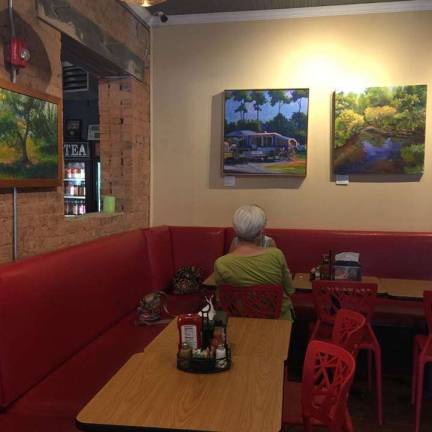 Janet Howard-Fatta's art hangs on the walls at Caffe a la Mode in Wariwck, now through mid-September.