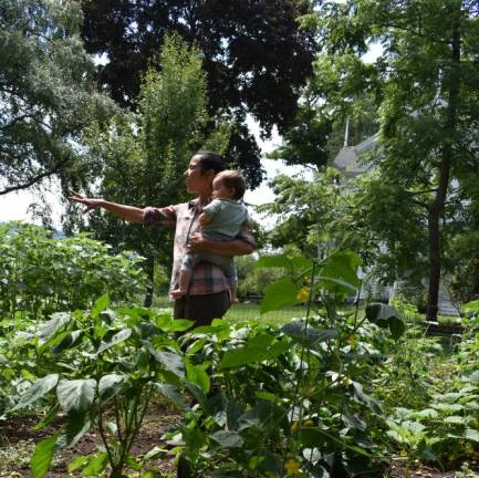 Christina Stephens of Vernon Valley Farms, with her helper Theo, shows her “miracle garden” to attendees at last year’s Kitchen Garden Tour. Her veggie patch was voted as one of the best gardens. Stephens will open her gates up to ticketholders again this year at the Kitchen Garden Tour on Sunday, Aug. 13. Tickets are available at kitchengardentours.com