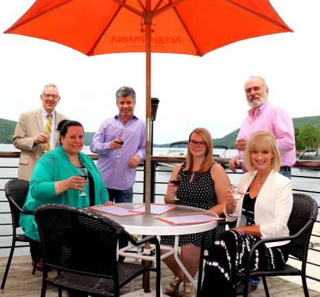 Photo by Roger Gavan Gearing up for the Warwick Valley Chamber of Commerce's June 21 lakefront business mixer are, clockwise from left: Chamber Executive Director Michael Johndrow, Cove Castle co-partner Sandra Frank, owner Bob Pereira, chamber assistant Bea Arner, Vice President John Redman and Programs Director Janine Dethmers.