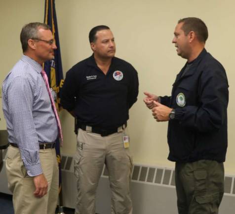 Provided photoPictured from left to right: Woodbury Common Premium Outlets General Manager Dave Mistretta, Orange County Commissioner of Emergency Services Brendan Casey and Orange County Executive Steven M. Neuhaus talk at the multi-discipline tabletop exercise at the I.B.E.W. Building in Harriman on Tuesday, Oct. 3.