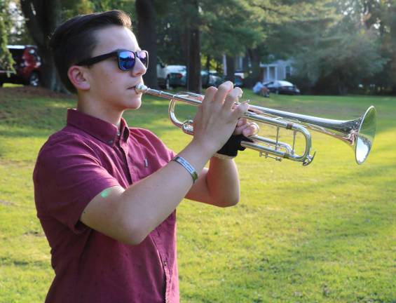 Zack Bauman, a member of the Warwick Valley High School Band, played taps.