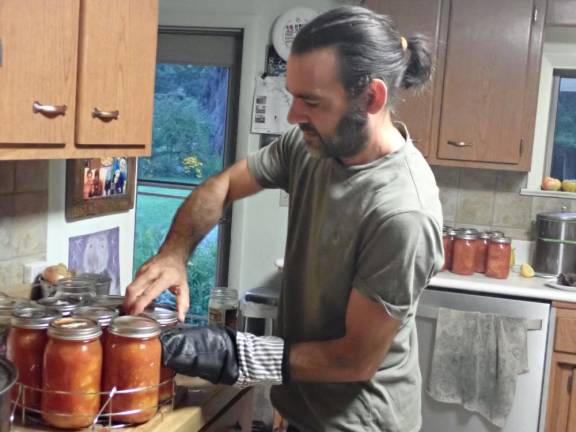 Joe Gara canning tomatoes for this winter’s sauce.