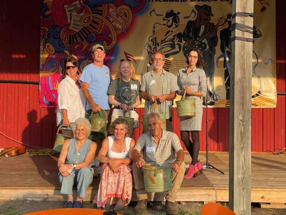 WM1 Winners, from back left: Dawn Mele, Patrick Moynihan, Kerry Mayer, Chad Pilieri from Grow Local Greenwood Lake, Denise Holster from Apple Acres Community Garden. Front row: Straus News President Jeanne Straus, Dirt Editor Becca Tucker, Larry Mansour.