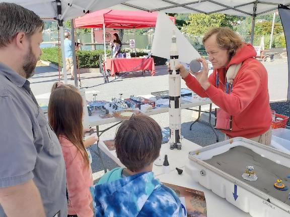 James Hall, NASA Ambassador, demonstrating the Saturn V rocket system that took astronauts to the moon and back at the Lakeside Farmers Market in Greenwood Lake. Provded photo.