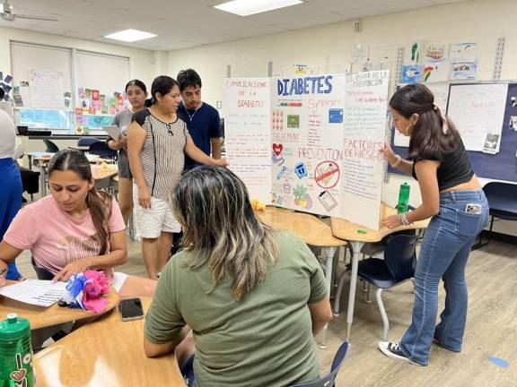 Parents of the students take a look at the healthcare projects.