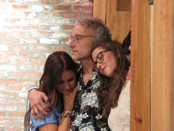 Glenn Arnowitz and his daughters, Lisa and Kara, are seen listening to &quot;The Mountain,&quot; sung by Suzy.