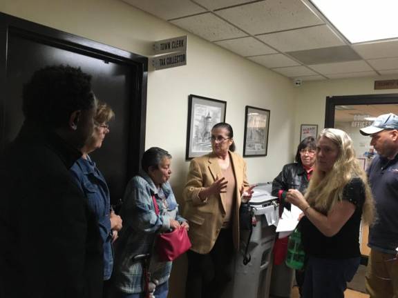 Members of Save Wawayanda powwow outside town hall after the Oct. 9 planning board meeting, where it was announced that Project Blue Bird had expanded to 3.2 million square feet. There are 11 new warehouses proposed for the town of 7,400 people.