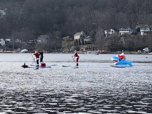 Santa, at right, exchanges the reindeer for a baby shark.