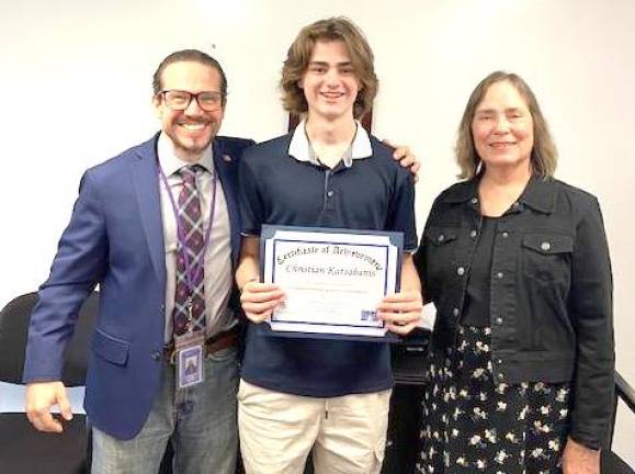 L-R: WVHS social studies teacher Kevan Ottachian, Chistian Katzabanis, Louise Reavis of LWV Mid-Hudson Region.