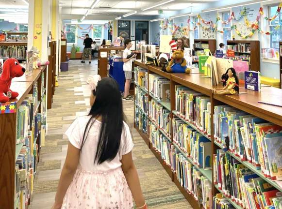 Goshen Public Library patrons during a family game night in July 2023.