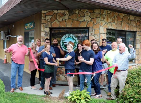 Photo by Roger Gavan On Monday morning, July 8, members of the Warwick Valley and Greenwood Lake Chambers of Commerce joined owner Christine Moley (center), local residents, employees, family and fiends to celebrate the restaurant&#x2019;s second anniversary with a ribbon-cutting ceremony.