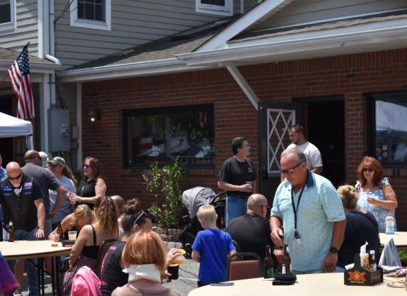 Murphy’s restaurant had a grill cooking and tables set up outside.