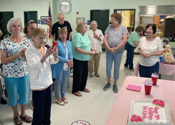 Fellow seniors celebrate the milestone on Wednesday.