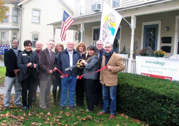 Photo by Roger Gavan On Friday, November 16, local officials and members of the Warwick Valley Chamber of Commerce joined Frances Cindy Hopper and her husband, Len, for the official grand opening of Sew-Cology sewing center, located at 19 West St. From left, Cedric Glasper, president of the Warwick Valley Chamber of Commerce; Vice President Sherry Bukovcan, Chamber Director Doug Stage, Town of Warwick Supervisor Michael Sweeton, Chamber Director Mechelle Casciotta, Len Hopper, Chamber Director Karen Burke, Cindy Hooper, Chamber Executive Director Michael Johndrow and Mayor Michael Newhard.