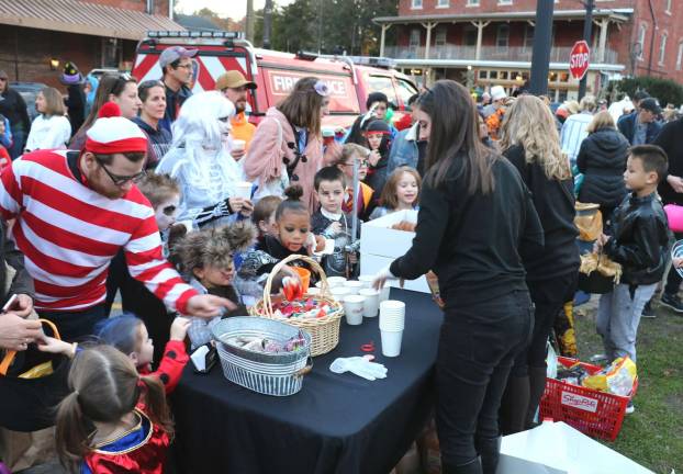 The marchers headed down Main Street to Railroad Avenue for a costume contest and Halloween treats.