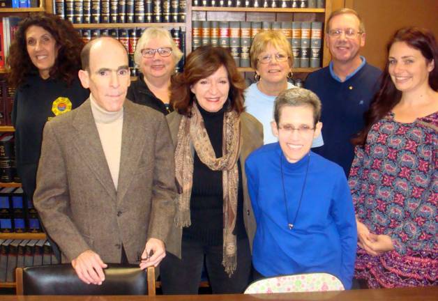 Photo by Wayne Patterson Planning continues for the annual Warwick Holiday Party for Children in Need. Among those organizing the Dec. 12 event at the Warwick Reformed Church are, left to right, Cheryl Crouchen of Chosun Taekwondo Academy; Glenn P. Dickes, a sponsor; Claire Gabelmann, chairperson from Warwick Lions Club; Tina Buck, chairperson from Warwick Valley Rotary Club; Shirley Puett, Backpack Snack Attack director; Susan P. Dickes, a sponsor; Neil Sinclair, Warwick Rotary president; and Erin Andersen, Warwick Lions Club president.