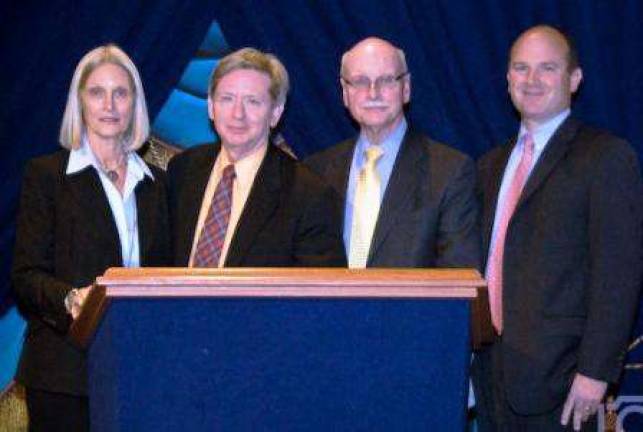 From left, Nan Gill, and attorneys Kevin McMullen, Bill J. Horan and Peter J. Wagner. Gill will present a class to New York County lawyers.